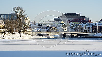 Neighborhood of old houses and modern buildings in winter. Retro versus modern style. Contrast in architecture. Stock Photo