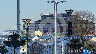 Neighborhood of old houses and modern buildings in winter. Retro versus modern style. Contrast in architecture. Stock Photo