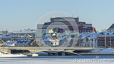 Neighborhood of old houses and modern buildings in winter. Retro versus modern style. Contrast in architecture. Stock Photo