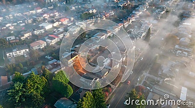 Neighborhood streets and homes covered in fog. Stock Photo