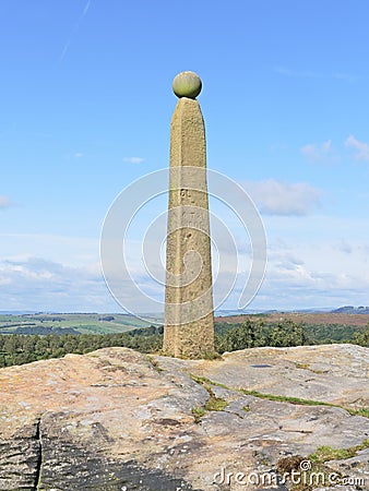 Nelsons tall weathered monument stands on the top of Birchen Edge Stock Photo