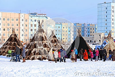 The Nenets dwellings against the city Editorial Stock Photo