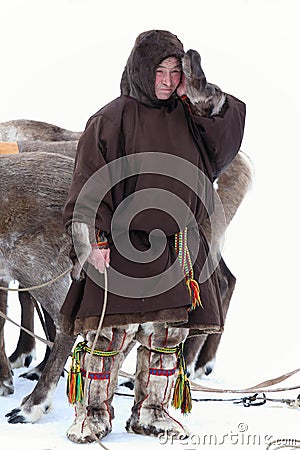 Nenets reindeer herder in traditional fur clothes covering the f Editorial Stock Photo