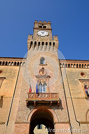 Neo-Gothic tower with clock built in red bricks Stock Photo