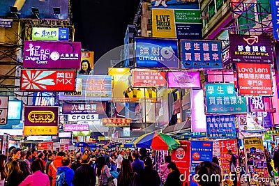 Neon Advertising in Hong Kong at Dusk Editorial Stock Photo