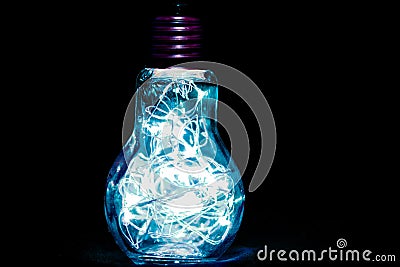 Neon blue lightbulb Stock Photo
