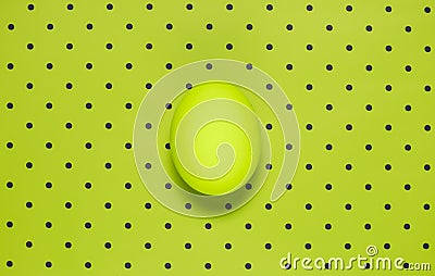 Flat lay of one green colored egg on bright green polka background Stock Photo