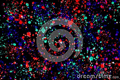 Neon green, purple and red round paint splashes on black background. Abstract texture for web, digital printing or concept design Stock Photo