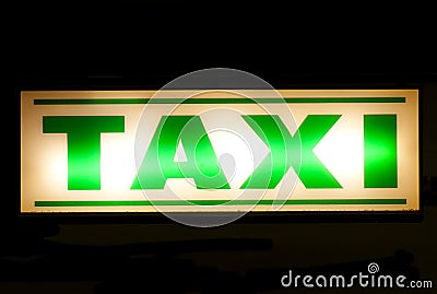 Neon green taxi sign Stock Photo