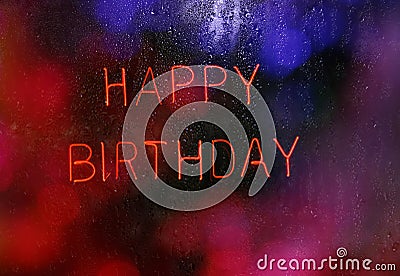 Neon Happy Birthday Sign With wet rainy window Stock Photo