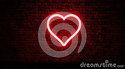 Neon heart on brick wall Stock Photo