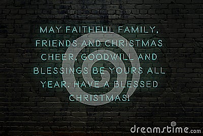 Neon inscription of christmas and new year greetings on brick wall Stock Photo