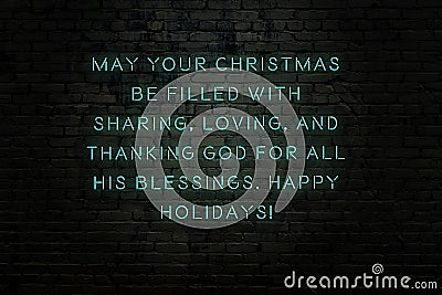 Neon inscription of christmas and new year greetings on brick wall Stock Photo