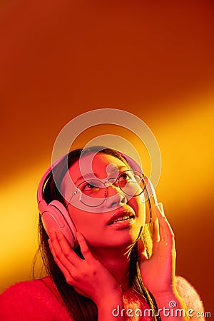 neon light face music inspiration girl headphones Stock Photo