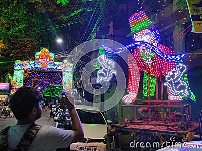 neon light with LED bulbs during the festive season when carnival parade is displayed in the city Editorial Stock Photo