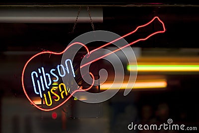 Neon light shaped into a guitar Editorial Stock Photo