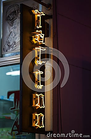 Neon light outside of a Tattoo parlor Editorial Stock Photo