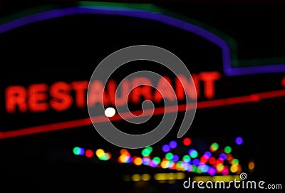 Neon restaurant blur image at night with bokeh Stock Photo