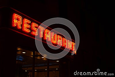 Neon Restaurant Sign by Night Stock Photo