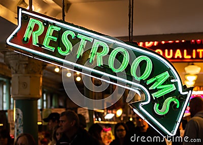 Neon Restroom Sign Pointing Down Editorial Stock Photo