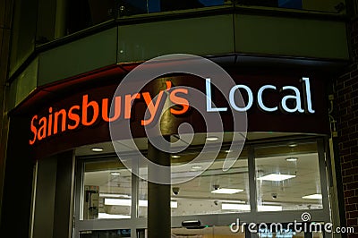 Neon Sainsbury's Local Sign Above Store Entrance Editorial Stock Photo