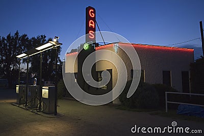 Neon sign at dusk reading Gas at Kensinger Service & Supply Editorial Stock Photo