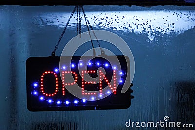 Neon sign Open on window shop. Stock Photo