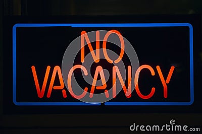 Neon sign reads ï¿½No Vacancyï¿½ for a motel at night Stock Photo