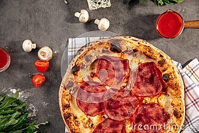 Neapolitan fresh baked ham pizza on grey Stock Photo