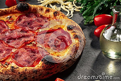 Neapolitan fresh baked ham pizza on grey Stock Photo