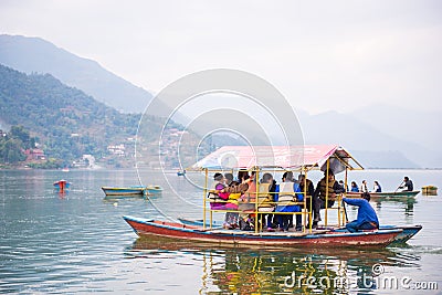 Nepal - 23 December 2016 :: boats at Phewa Lake in Nepal Editorial Stock Photo