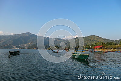 Nepal - Phewa Lake with colorful boats driffting on it Editorial Stock Photo