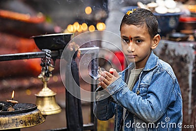 Nepalese child praying Editorial Stock Photo