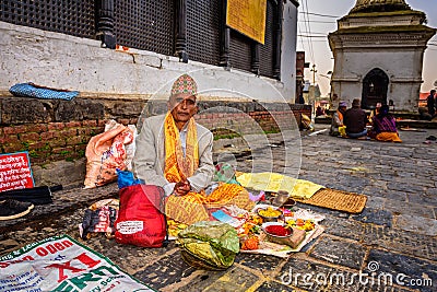 Nepalese man selling religious tools in ancient Pashupatinath Temple Editorial Stock Photo