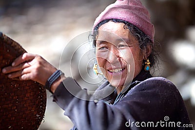 Nepalese peasant woman with basket Editorial Stock Photo