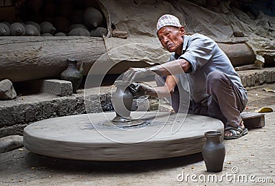 Nepalese potter working in the his pottery workshop Editorial Stock Photo