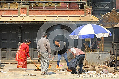 Nepalese worshipers giving religious offerings in Nepal Editorial Stock Photo