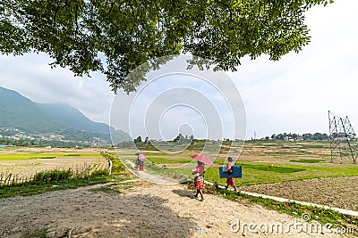 Nepali/Asian farmers heading towards field Editorial Stock Photo