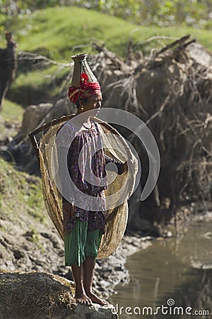 Nepali Taru woman fishing with net Editorial Stock Photo