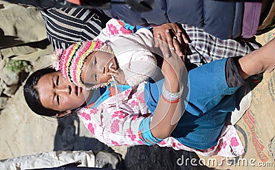 Nepali woman and her baby Editorial Stock Photo