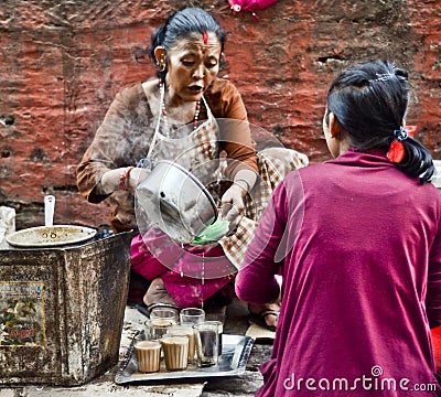 Nepali woman selling local drinks Editorial Stock Photo