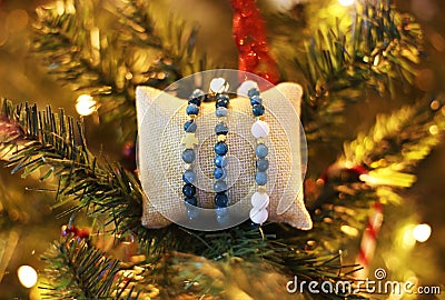 Nephrite gemstone bracelets on Christmas tree - Christmas gift jewelry Stock Photo