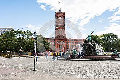 Neptunbrunnen fountain and Rotes Rathaus in Berlin Editorial Stock Photo