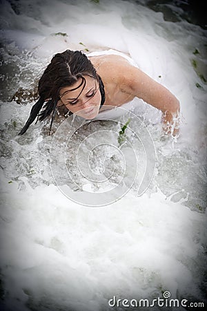 Neptune's mermaid bride - trash the wedding dress Stock Photo