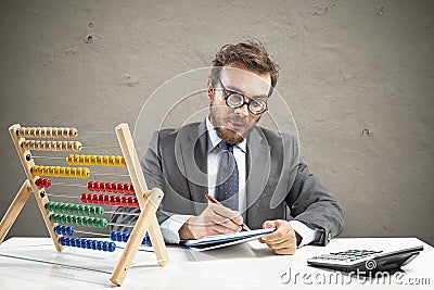 Nerd accountant does calculation of company revenue Stock Photo