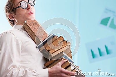 Nerd with books, displays social ineptitude Stock Photo