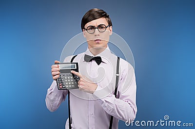 Nerd with calculator. Stock Photo