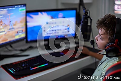 Nerd child playing computer games Stock Photo