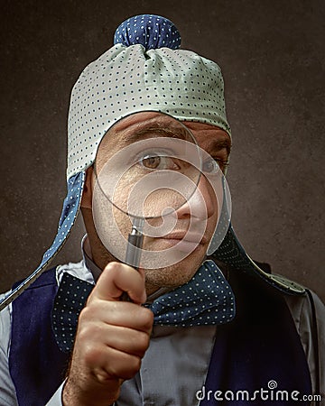 Nerd, Funny male portrait with magnifier loupe Stock Photo