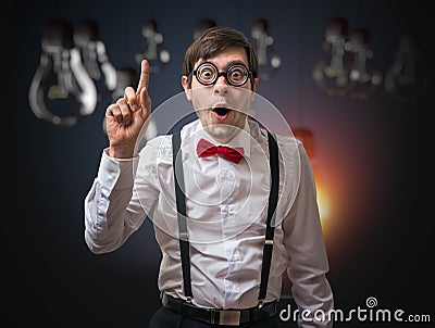 Nerd genius have an idea. Funny man with raised finger. Stock Photo